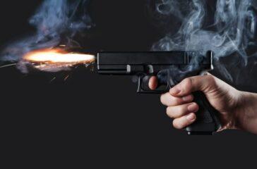 Handgun firing with fire and smoke
