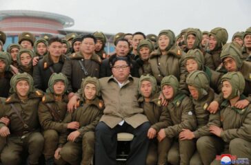 North Korean leader Kim Jong Un poses with sharpshooters of the Air and Anti-Aircraft Force in North Korea