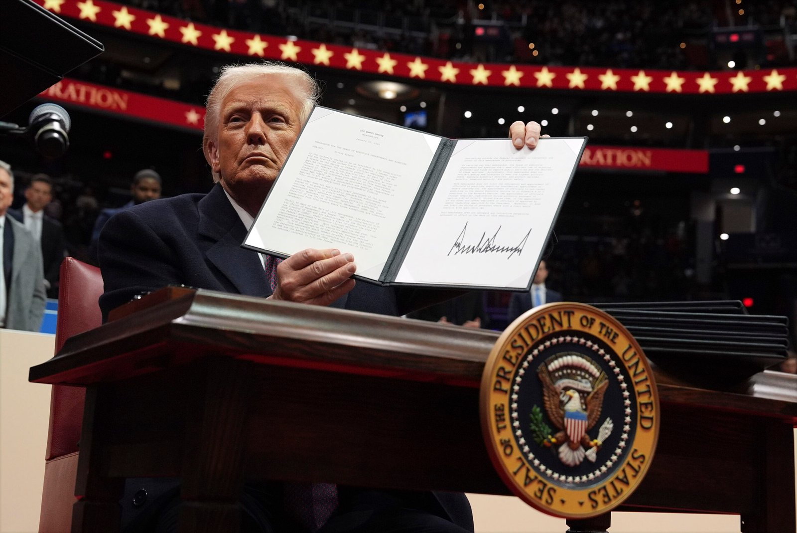 President Donald Trump signs ऽ President Donald Trump signs ऽ