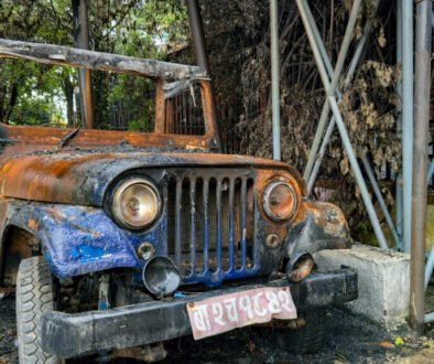 The blue car of Ba-2-Cha 1842, used by saint leader Krishna Prasad Bhattarai, could not escape being set on fire by protesters.