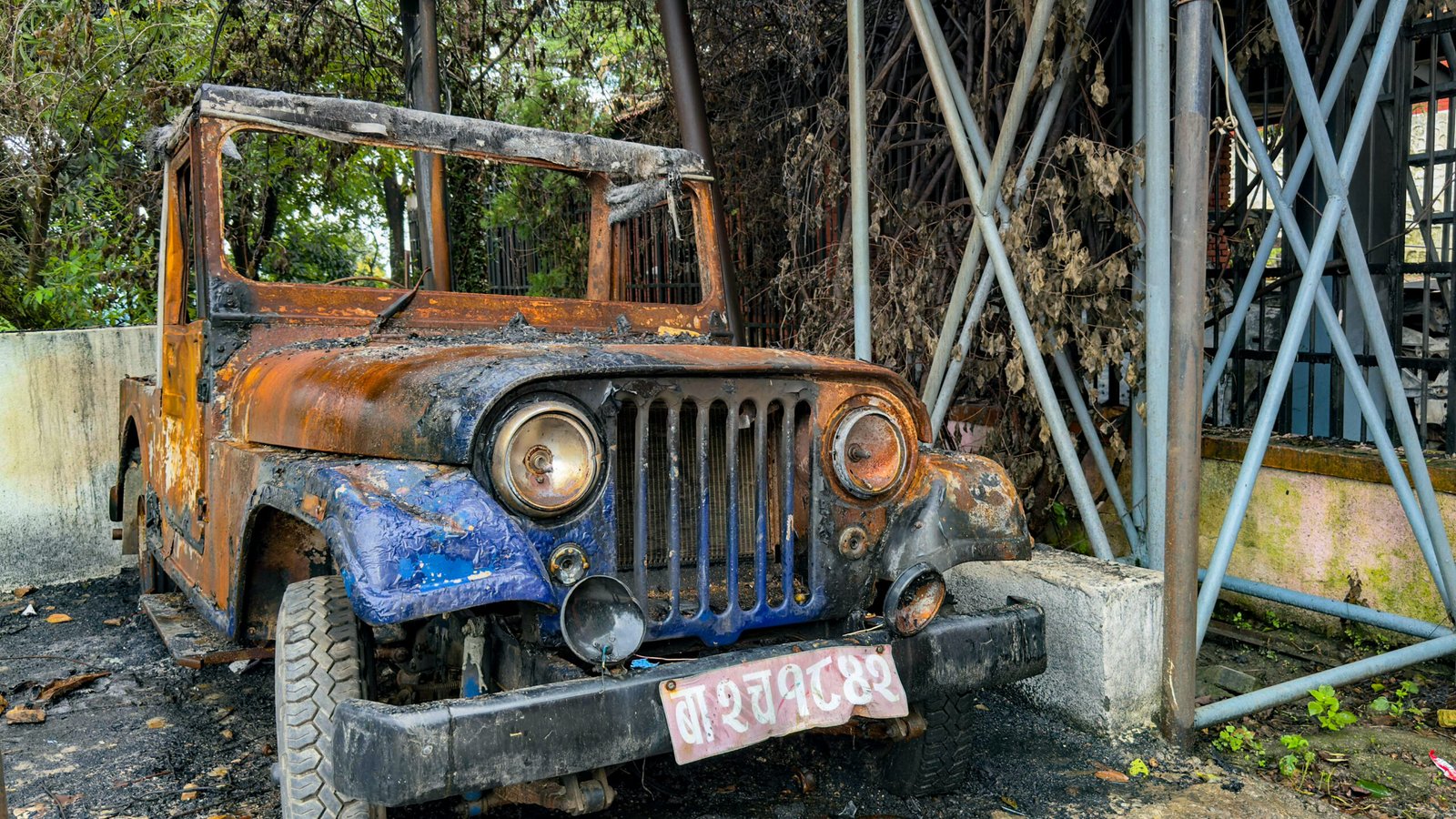 The blue car of Ba-2-Cha 1842, used by saint leader Krishna Prasad Bhattarai, could not escape being set on fire by protesters. The blue car of Ba-2-Cha 1842, used by saint leader Krishna Prasad Bhattarai, could not escape being set on fire by protesters.