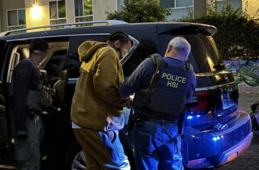 Nakahli Miller being prepared for transport after his arrest