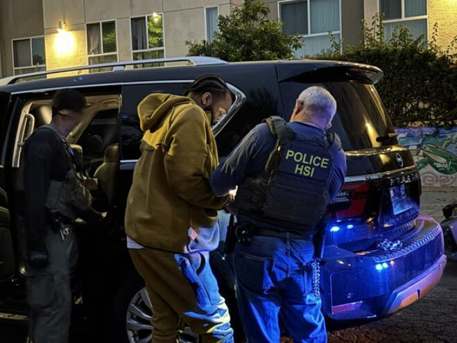 Nakahli Miller being prepared for transport after his arrest